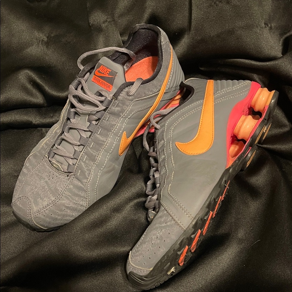 Nike women’s Gray Sneakers with Orange Accents and hot pink.